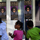 Children look through the glass as fans of musical artist Prince enter his Rally 4 Peace concert in Baltimore May 10, 2015.
Andrew Caballero-Reynolds/AFP/Getty Images